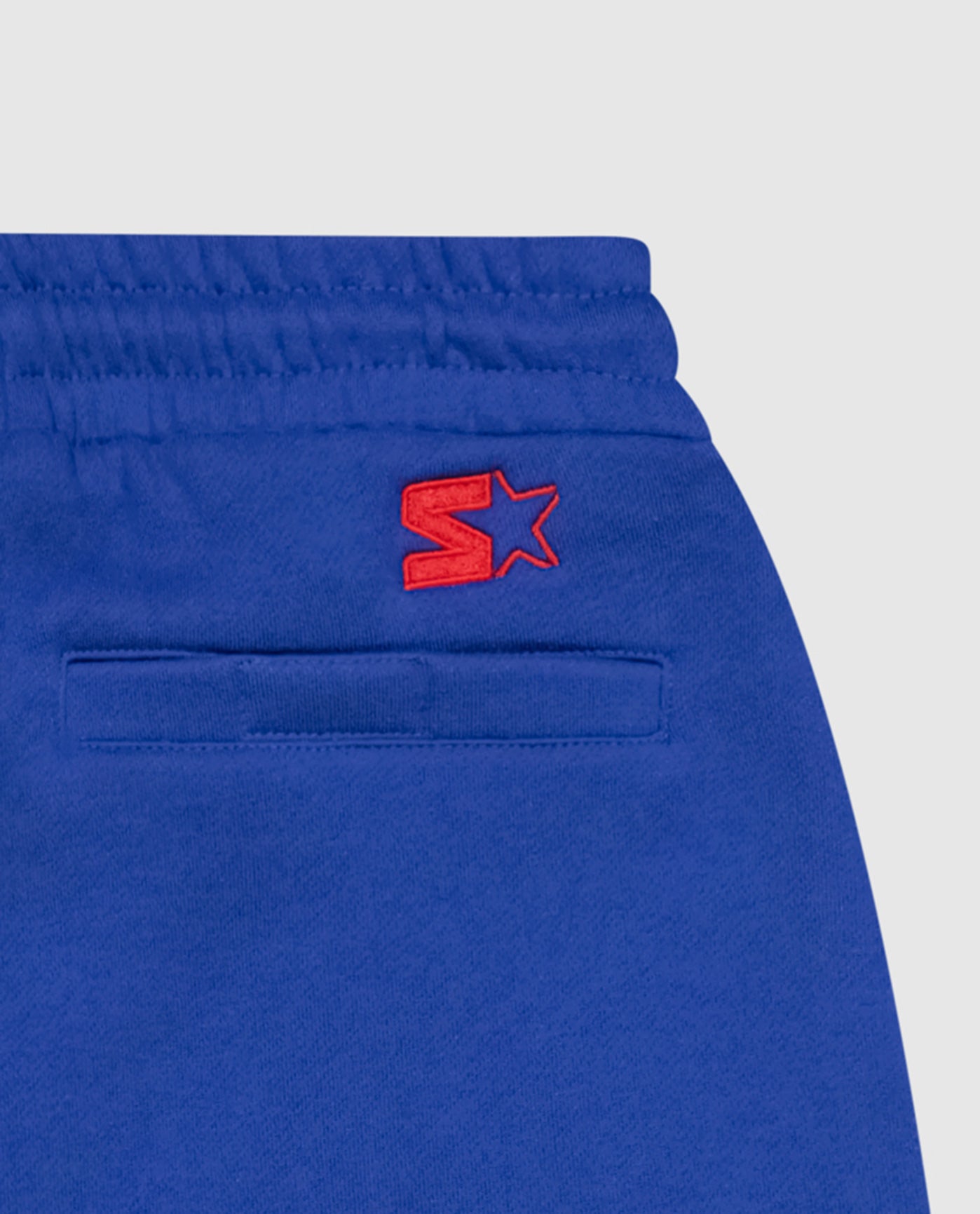 Starter logo below the right waist back graphic | Patriots Blue
