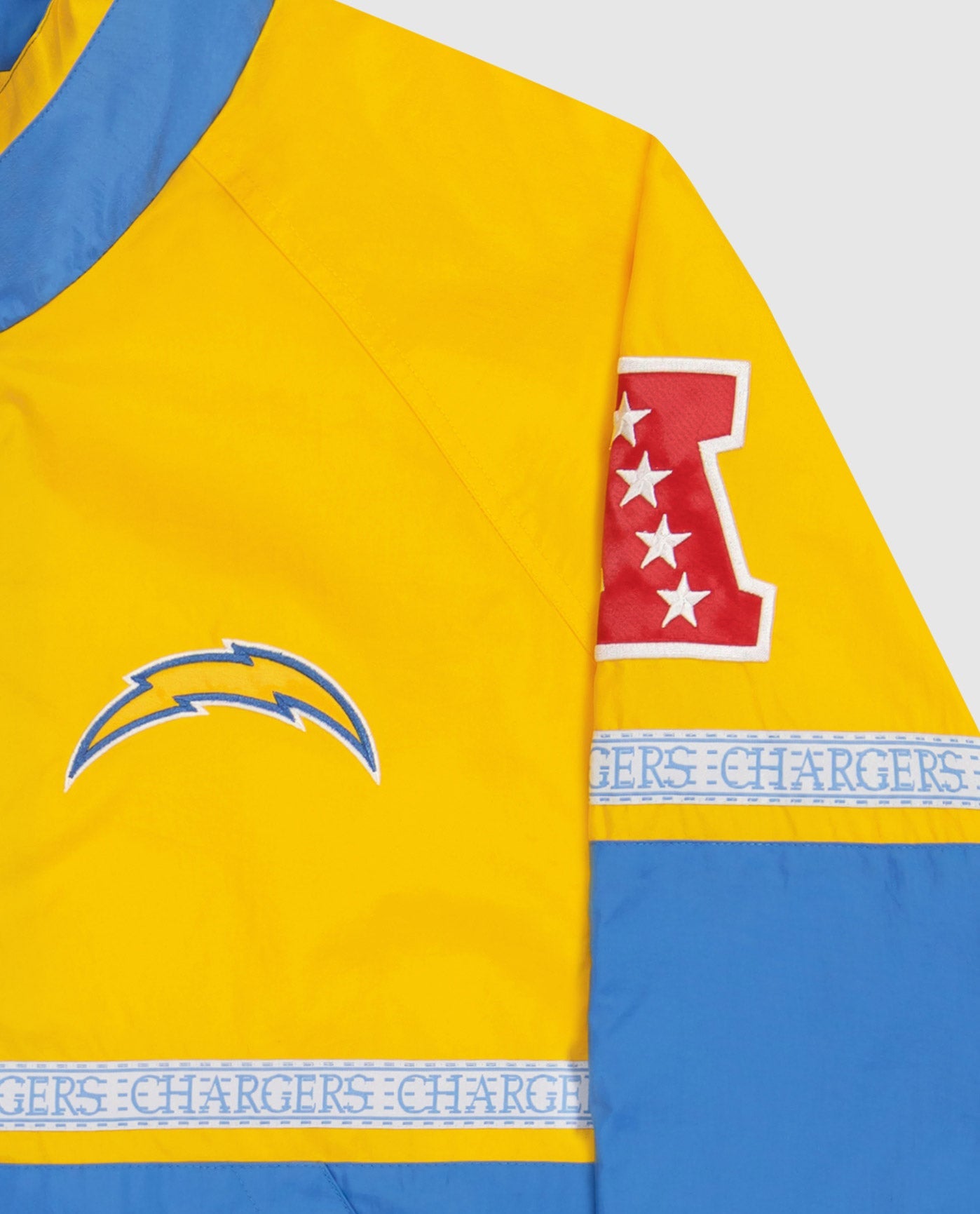 Los Angeles Chargers logo top left chest,Twill Applique Conference logo and "LOS ANGELES CHARGERS" tape on mid body and sleeves | Chargers Gold Light Blue