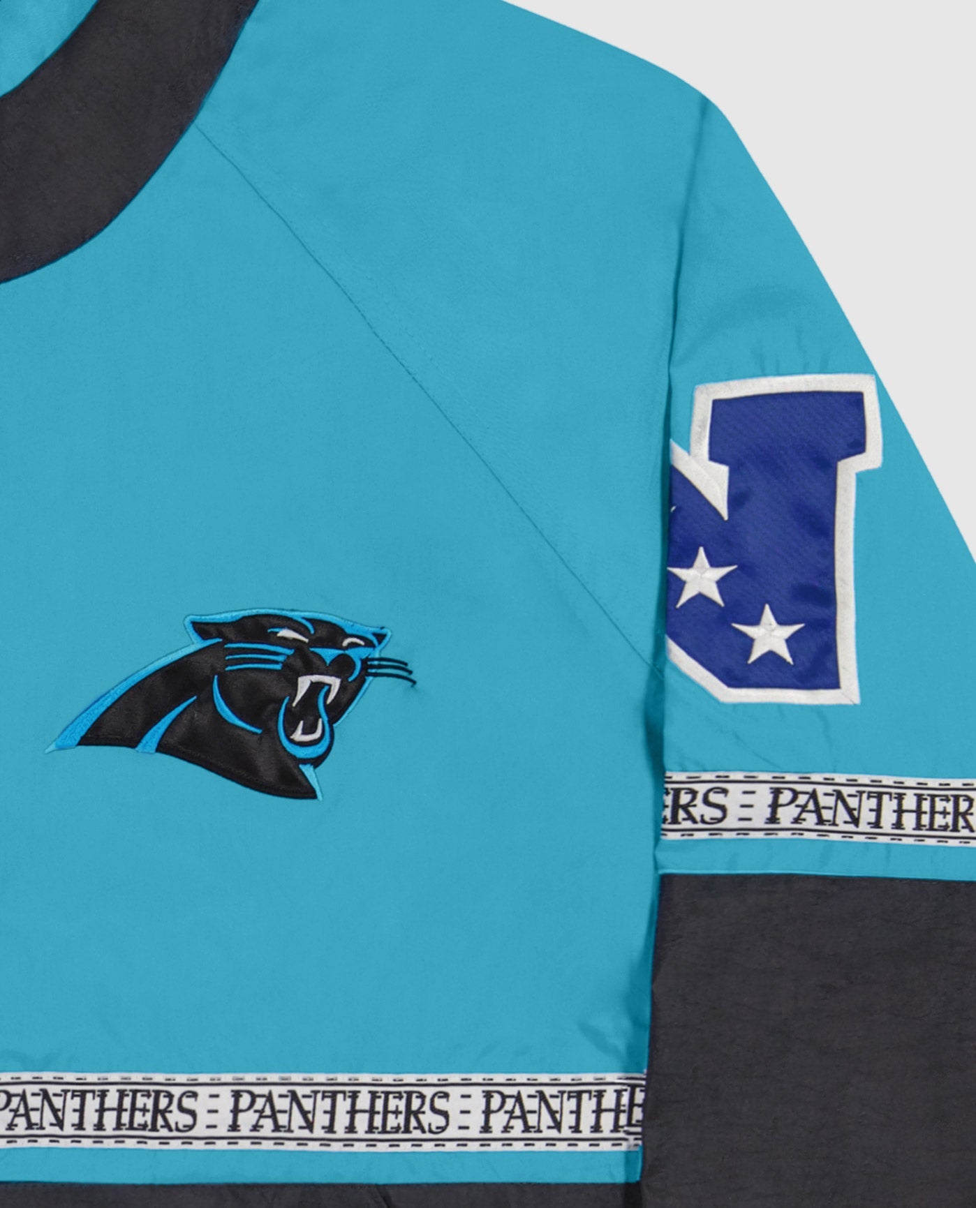 Carolina Panthers logo top left chest,Twill Applique Conference logo and "PANTHER" tape on the mid body and sleeves | Panthers Light Blue Black